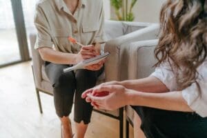 Hands of two people talking about how OCD is diagnosed