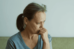 Person struggling with trauma and depression