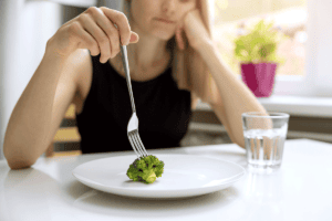 Person struggling with OCD and an eating disorder