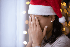 Person feeling holiday anxiety