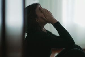 Person struggling with depression and procrastination