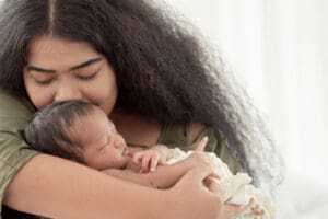 Person experiencing postpartum depression symptoms