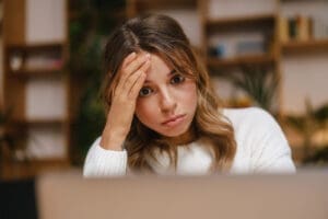 Person learning about the connection between trauma and anger